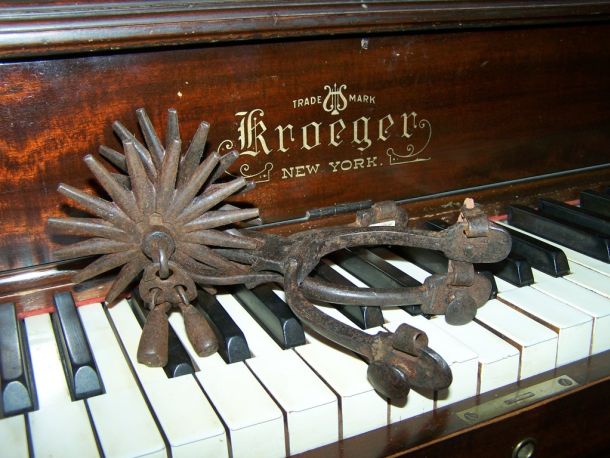 Old Spurs on a Piano Keys